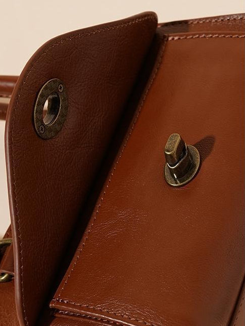 The Vintage Turnlock Genuine Leather Mini Top Handle Crossbody Bag