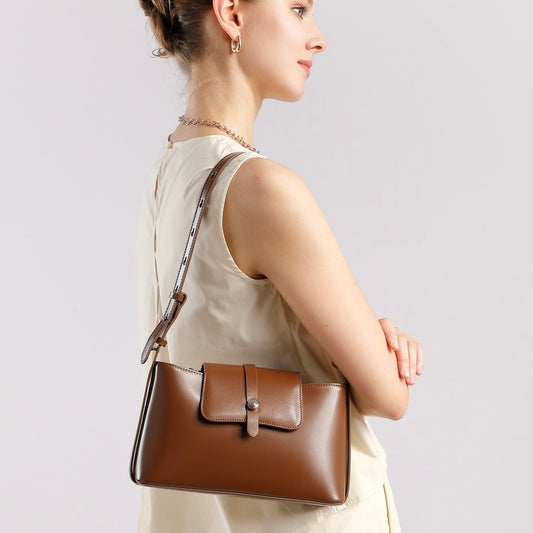 Bolso de cuero elegante, versátil y de mano para el viajero urbano