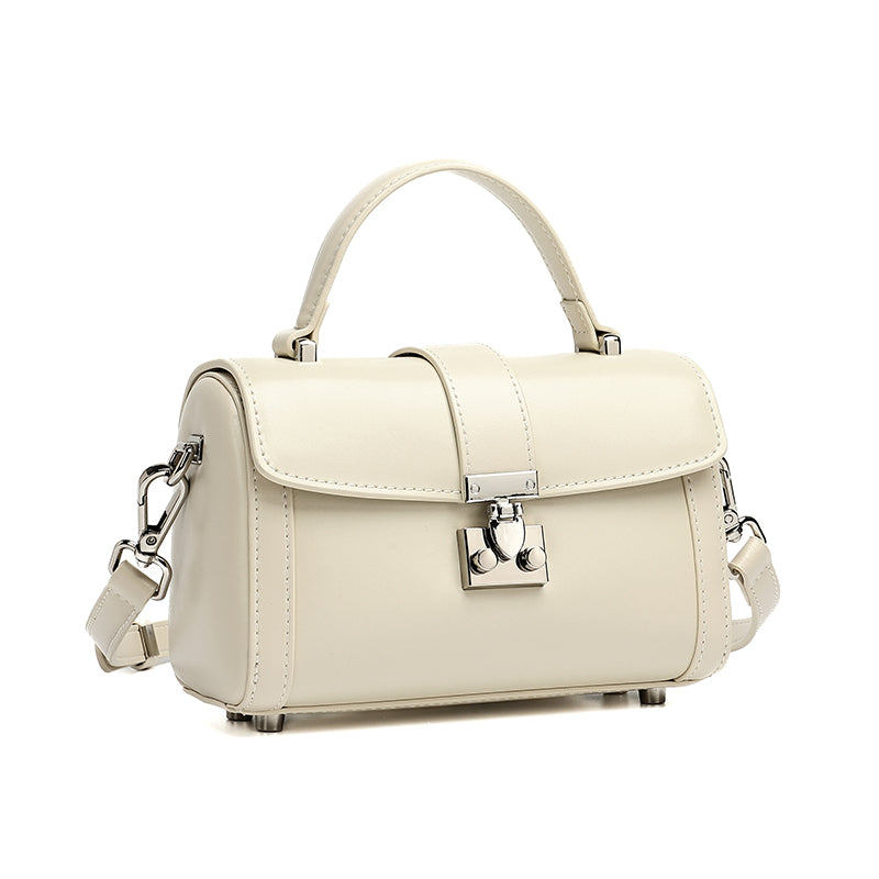 Bolso de mano tipo clutch cilíndrico de cuero genuino con estilo chic  