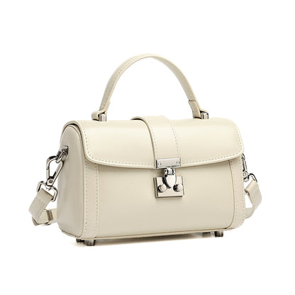 Bolso de mano tipo clutch cilíndrico de cuero genuino con estilo chic  