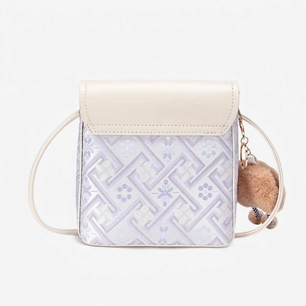 Mini sac bandoulière raffiné en cuir écologique végan avec jolie breloque