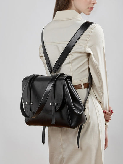 The Oil-Waxed Genuine Leather Convertible Flap Backpack Shoulder Bag