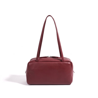 Bolso de mano tipo clutch minimalista de piel de oveja genuina con forma de bolera