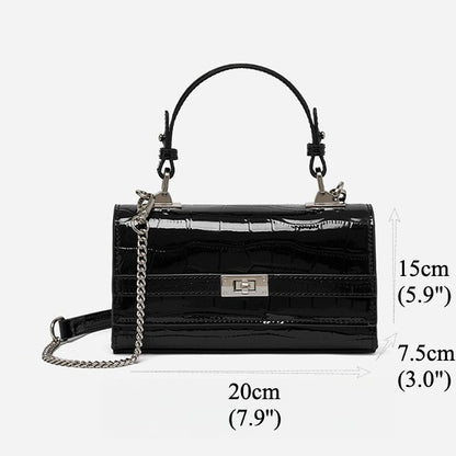 Bolso clutch sobre vintage de cuero genuino con acabado brillante tipo cocodrilo