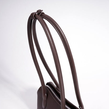Minimalist Supple Genuine Leather Curved Clutch Bag with Playful Charm