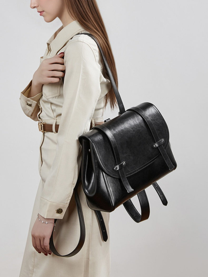 The Oil-Waxed Genuine Leather Convertible Flap Backpack Shoulder Bag