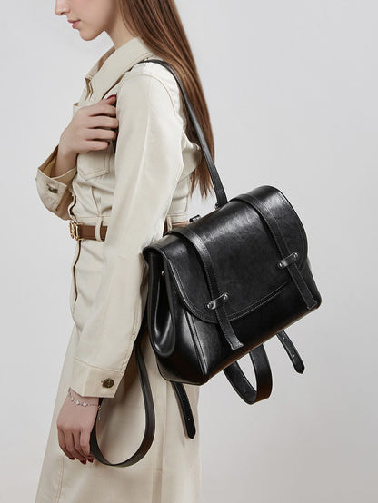 The Oil-Waxed Genuine Leather Convertible Flap Backpack Shoulder Bag