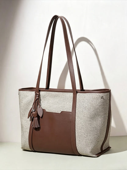 Borsa pochette tote capiente in tela, dal design minimalista