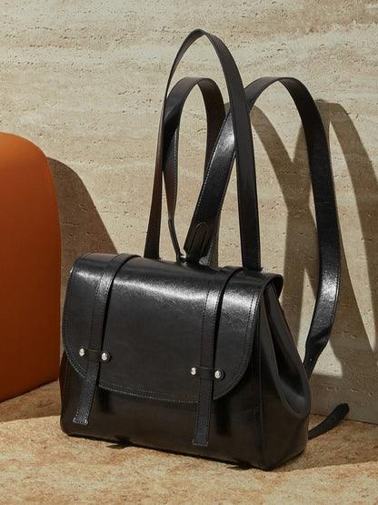 The Oil-Waxed Genuine Leather Convertible Flap Backpack Shoulder Bag