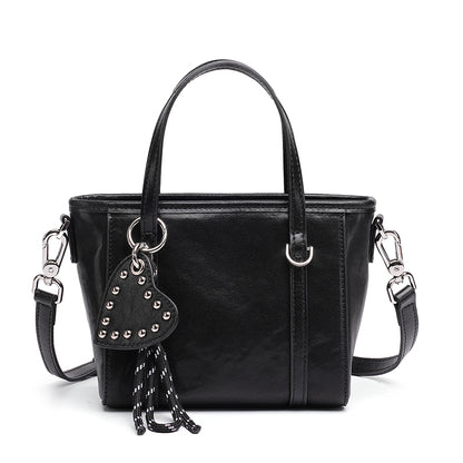 Mini tote a tracolla in vera pelle scolpita con distintivo cuore