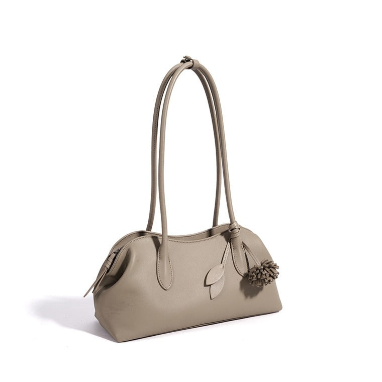 Minimalist Supple Genuine Leather Curved Clutch Bag with Playful Charm