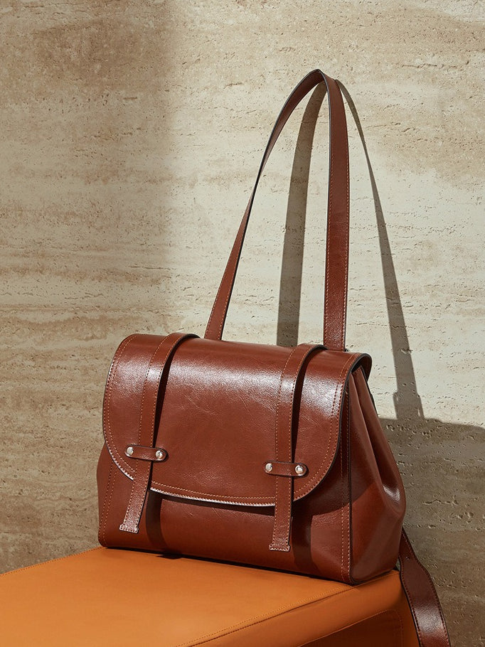 The Oil-Waxed Genuine Leather Convertible Flap Backpack Shoulder Bag
