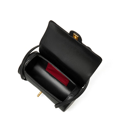 Bolso de mano tipo clutch nostálgico de cuero genuino color caviar, con forma de baguette tubular
