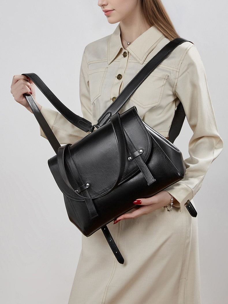 The Oil-Waxed Genuine Leather Convertible Flap Backpack Shoulder Bag