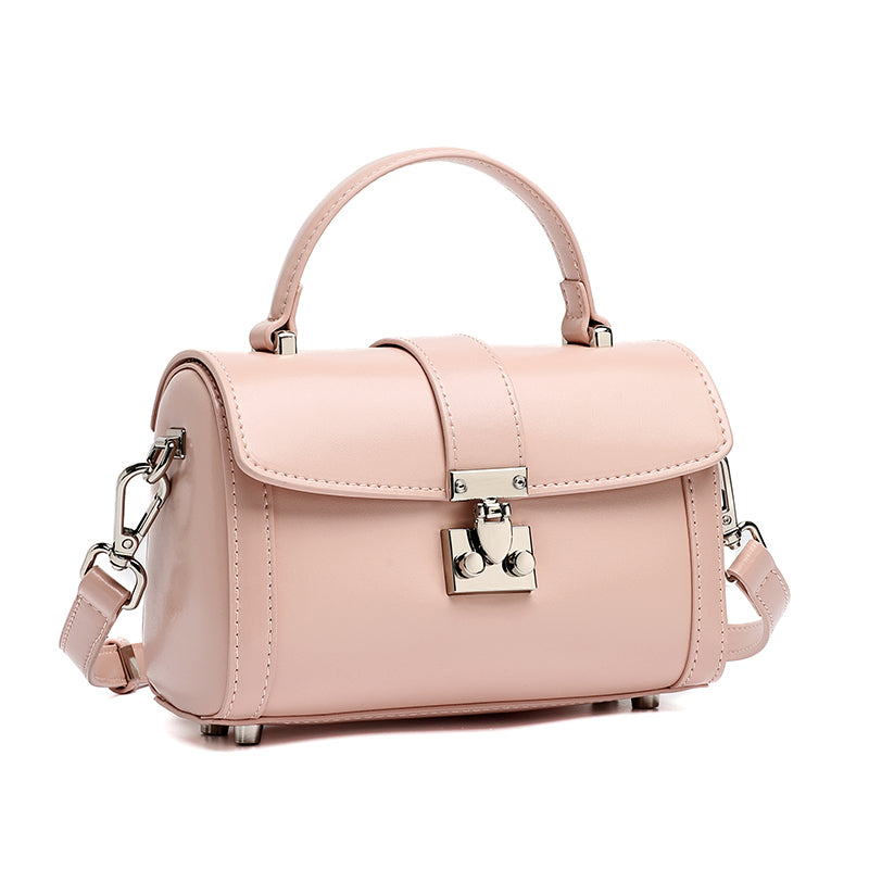 Bolso de mano tipo clutch cilíndrico de cuero genuino con estilo chic  