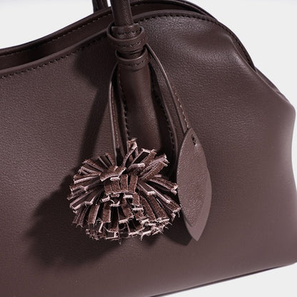 Minimalist Supple Genuine Leather Curved Clutch Bag with Playful Charm