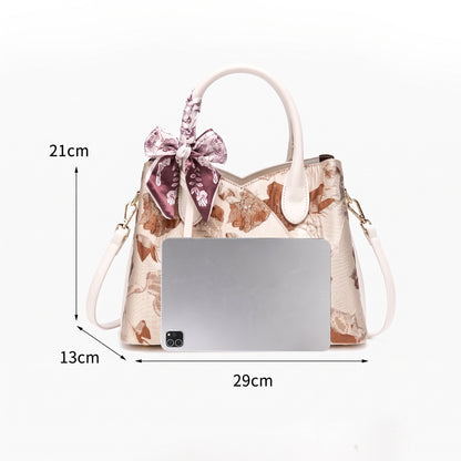 Borsa pochette floreale in jacquard di lusso discreto, in ecopelle vegana, con charm a foulard di seta