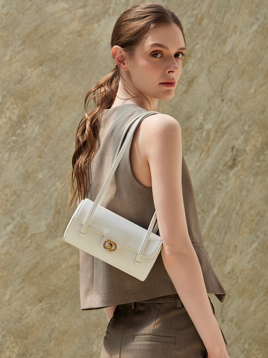 Bolso de mano tipo clutch nostálgico de cuero genuino color caviar, con forma de baguette tubular