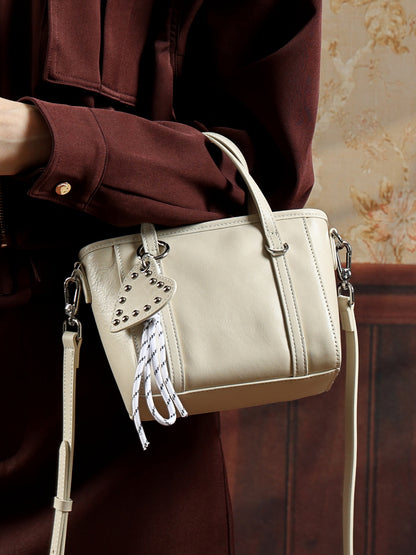 Mini tote a tracolla in vera pelle scolpita con distintivo cuore
