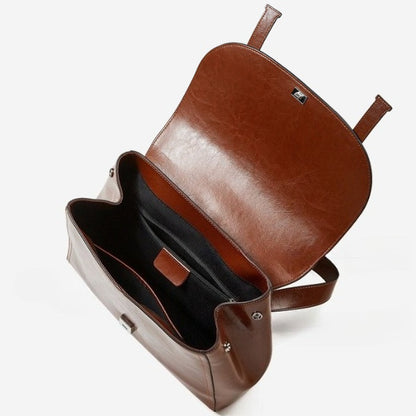 The Oil-Waxed Genuine Leather Convertible Flap Backpack Shoulder Bag