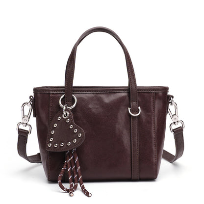 Mini tote a tracolla in vera pelle scolpita con distintivo cuore