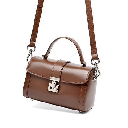 Bolso de mano tipo clutch cilíndrico de cuero genuino con estilo chic  