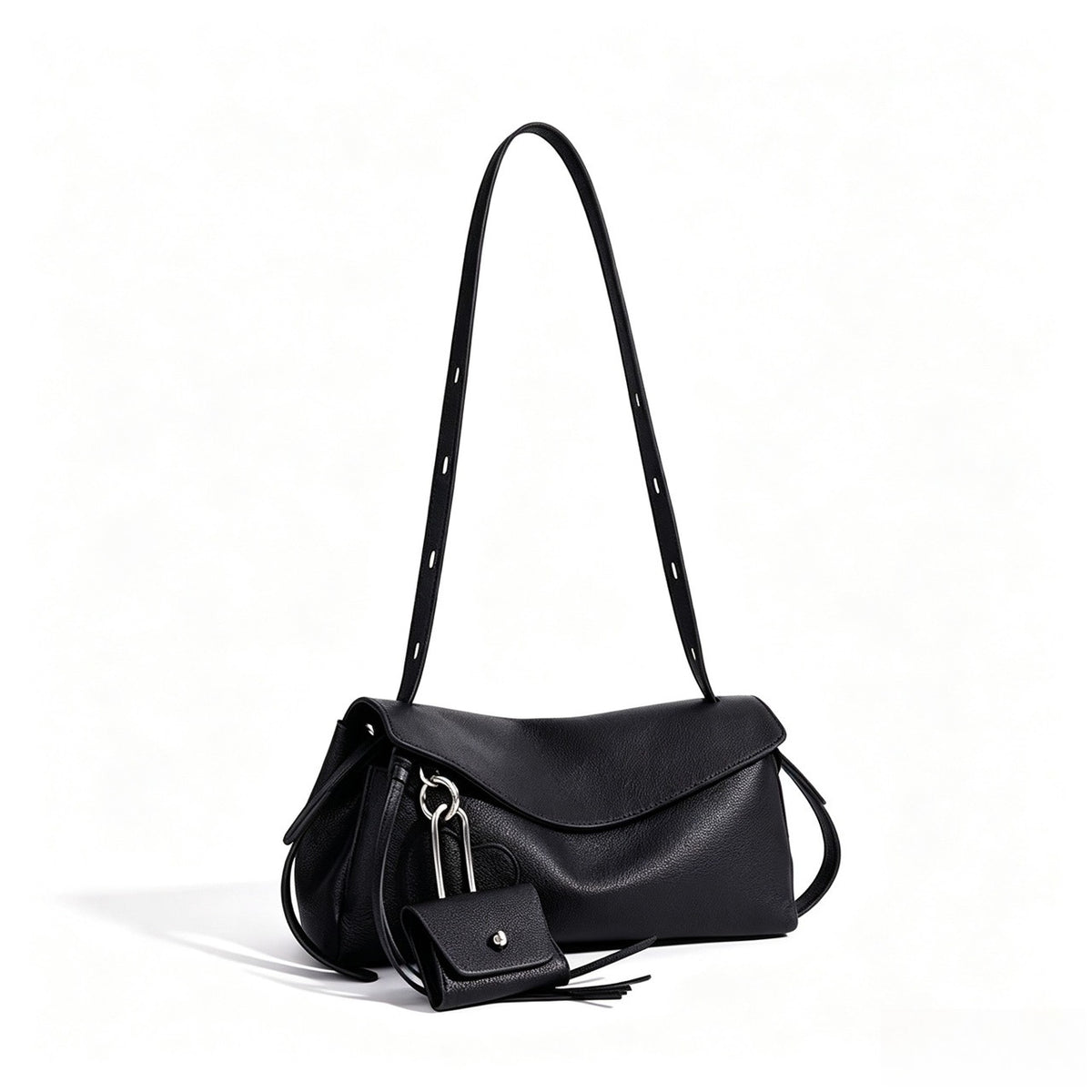 Skulpturale, lässig fallende Klapp-Clutch aus echtem Leder mit Mini-Münztäschchen