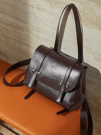 The Oil-Waxed Genuine Leather Convertible Flap Backpack Shoulder Bag