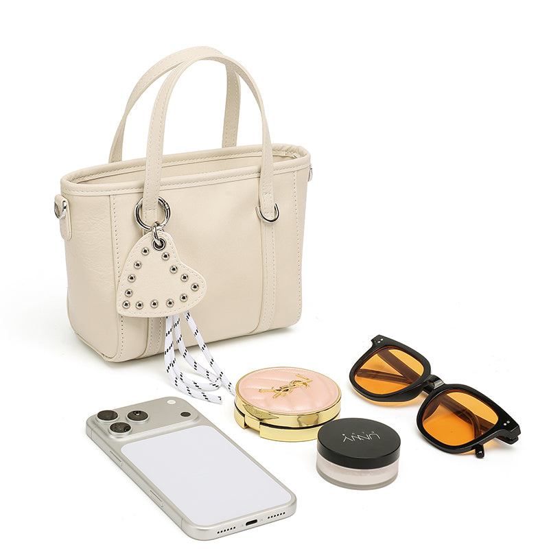 Mini tote a tracolla in vera pelle scolpita con distintivo cuore