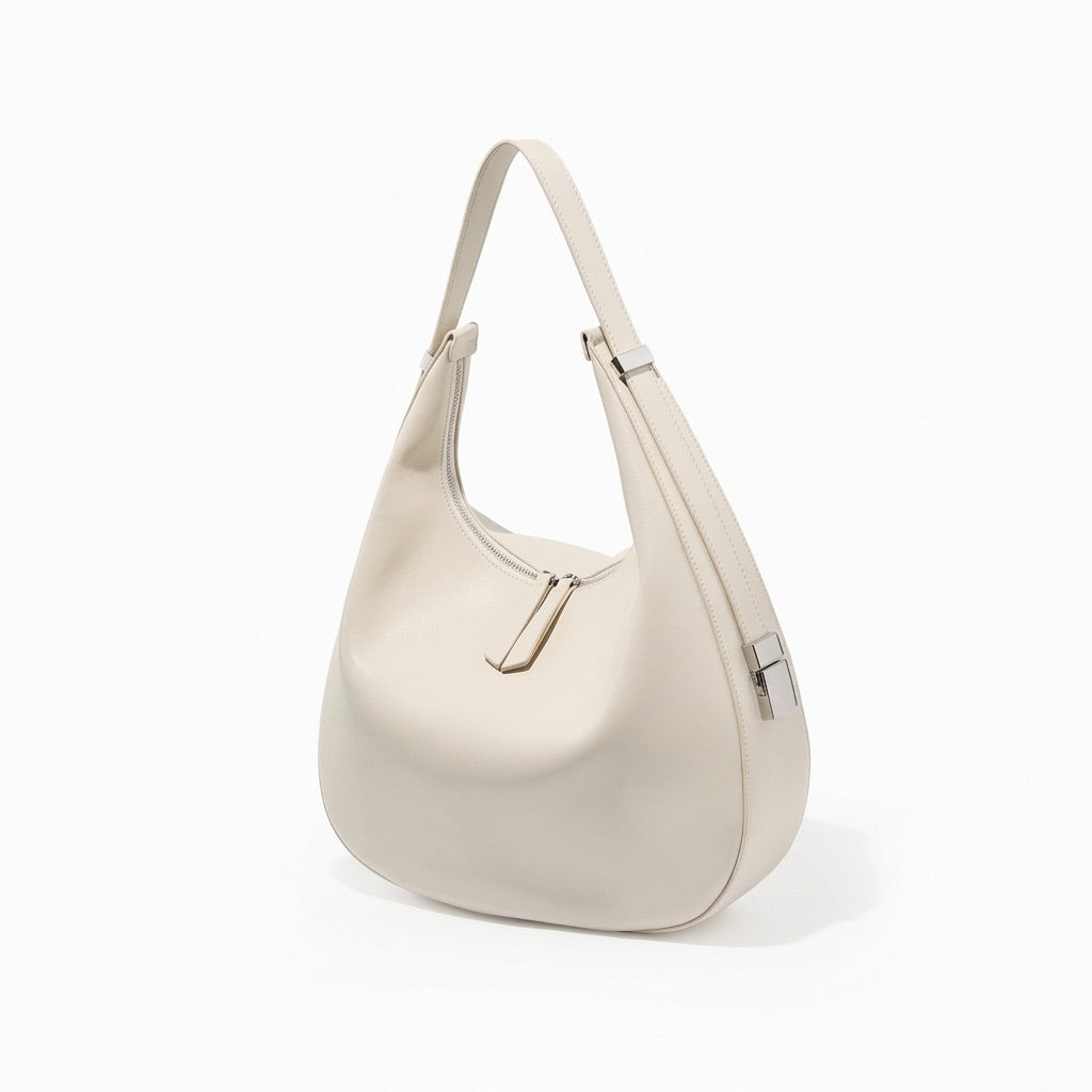 Borsa a tracolla a mezzaluna minimalista in vera pelle