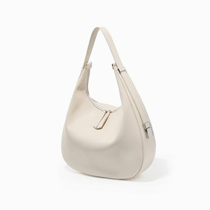 Borsa a tracolla a mezzaluna minimalista in vera pelle