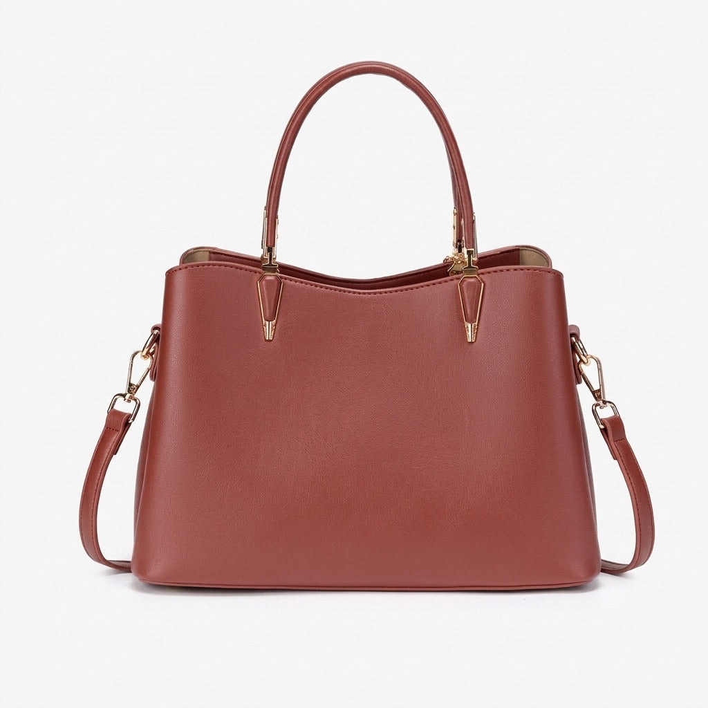 Borsa pochette floreale in ecopelle vegana, dal lusso discreto, con charm a foglia