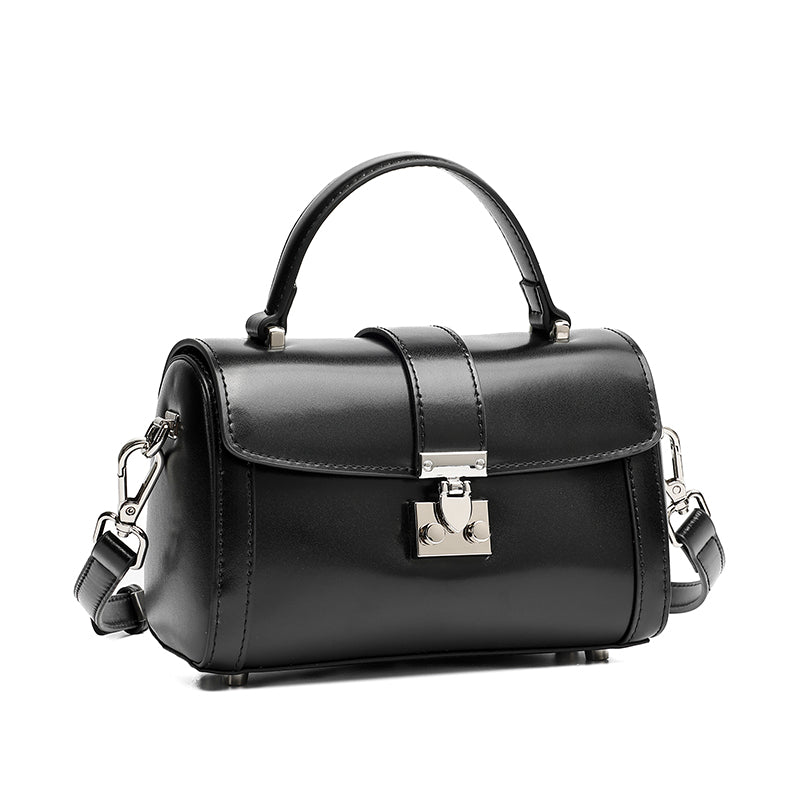 Bolso de mano tipo clutch cilíndrico de cuero genuino con estilo chic  