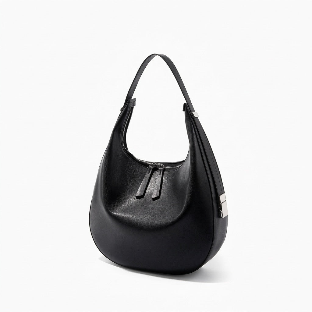 Borsa a tracolla a mezzaluna minimalista in vera pelle