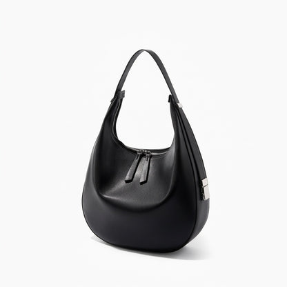 Borsa a tracolla a mezzaluna minimalista in vera pelle