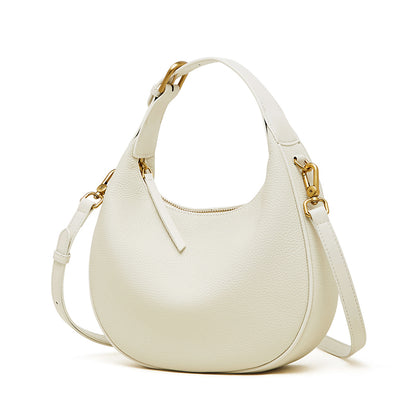 Borsa minimalista a spalla e tracolla a mezzaluna in vera pelle martellata