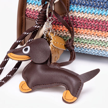 Borsa clutch Boston vivace a righe arcobaleno in ecopelle vegana con simpatico charm a forma di bassotto