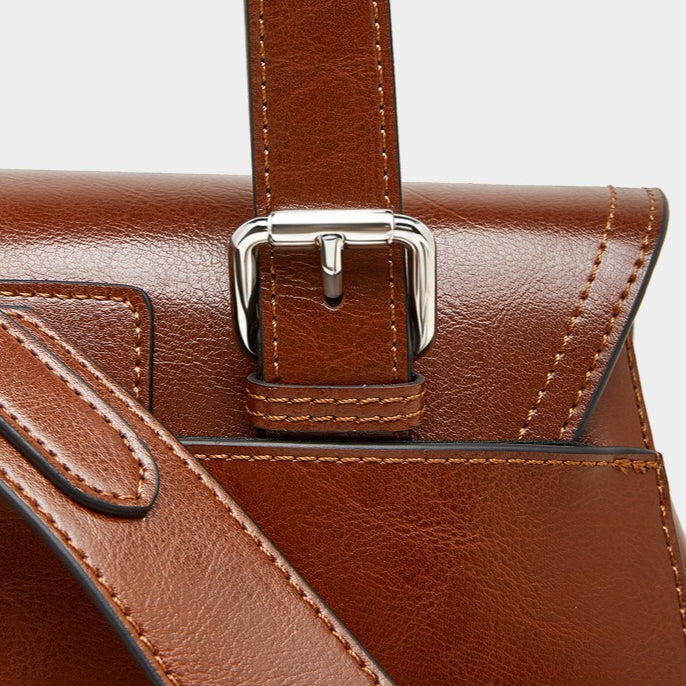 The Oil-Waxed Genuine Leather Convertible Flap Backpack Shoulder Bag
