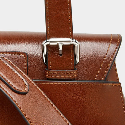 The Oil-Waxed Genuine Leather Convertible Flap Backpack Shoulder Bag