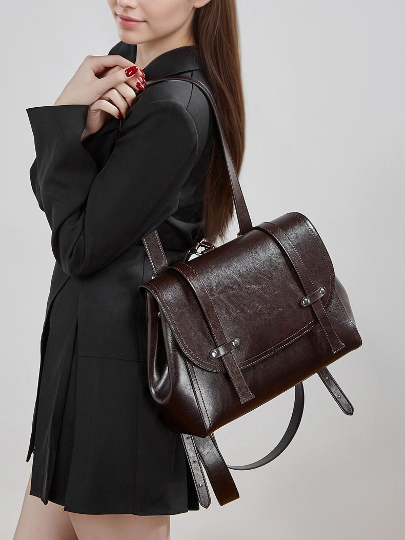 The Oil-Waxed Genuine Leather Convertible Flap Backpack Shoulder Bag