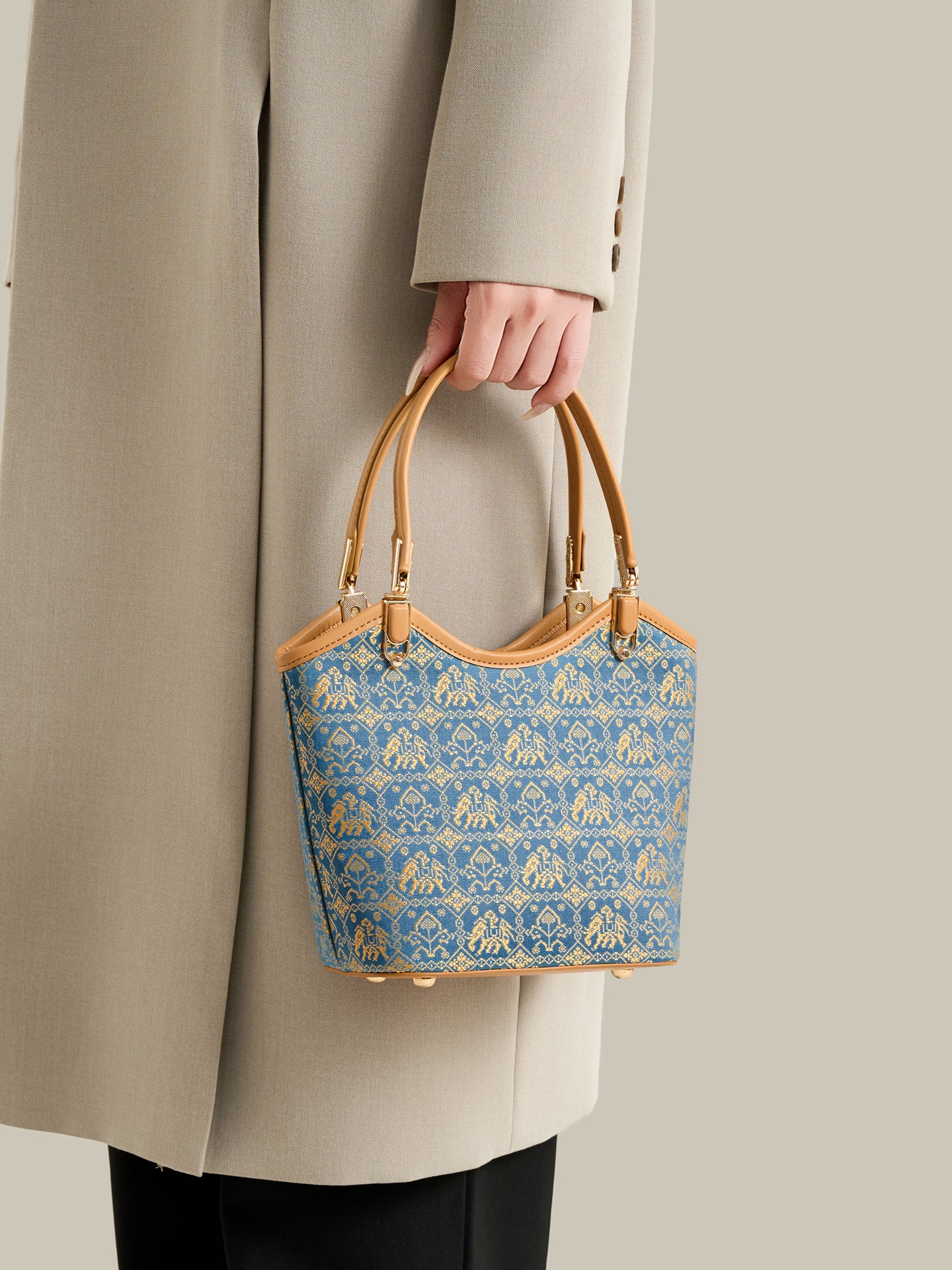 Refined Golden Elephant Motif Vegan Eco-Leather Bucket Clutch Bag