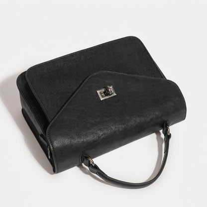 Pochette messenger retrò a busta geometrica in vera pelle