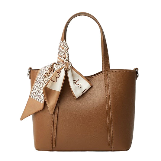 Brown handbag with a decorative scarf on a white background