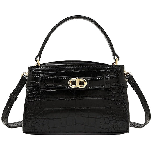 Black crocodile-patterned handbag with a gold clasp on a white background