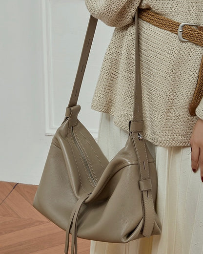 Women's Genuine Pebbled Leather Crescent Bag with Tassel Accent