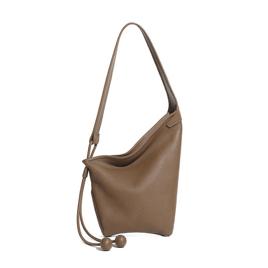 Bolso cruzado de hombro con diseño asimétrico minimalista y forma de cuerno holgado