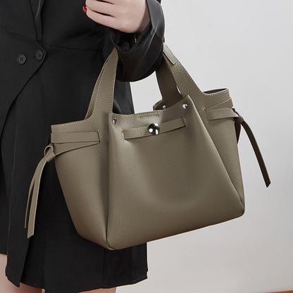 The Pebbled Genuine Leather Mini Bucket Tote Bag with Turn-Lock Closure