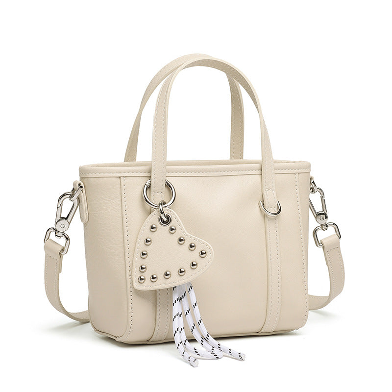 Sculpted Genuine Leather Mini Tote Crossbody Bag with Signature Heart Charm