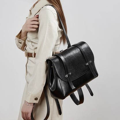 The Oil-Waxed Genuine Leather Convertible Flap Backpack Shoulder Bag
