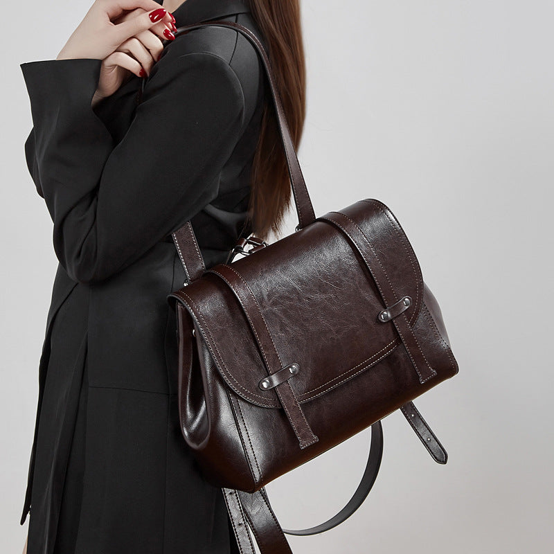 The Oil-Waxed Genuine Leather Convertible Flap Backpack Shoulder Bag